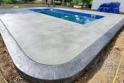 Concrete poured around a pool deck 