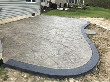 Stamped concrete that is gray with a black border